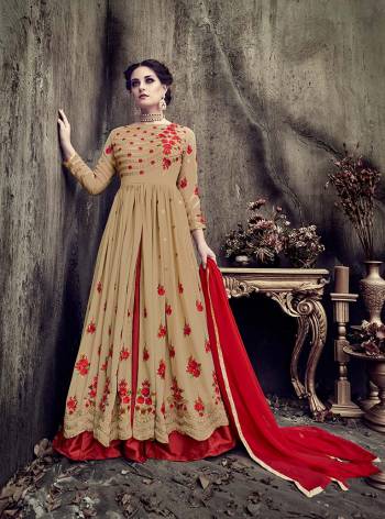 Flaunt Your Rich And Elegant Taste Wearing This Designer Indo-Western Suit In Beige Color Paired With Red Colored Bottom And Dupatta. Ist Top Is Fabricated On Georgette Paired With Art Silk Bottom And Chiffon Dupatta. It Has Contrasting Embroidery Over The Top Which Is Making The Suit Attractive.
