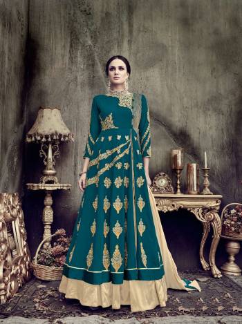 You Will Definitely Earn Lots Of Compliments Wearing This Designer Indo-Western Suit In Teal Blue Color Paired With Beige Colored Bottom And Dupatta. Its Top Is Fabricated On Georgette Paired With Art Silk Bottom And Chiffon Dupatta. It Has Colors And Attractive Embroidery. Buy This Suit Now.