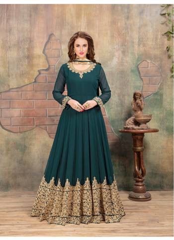 New And Pretty Shade In Blue Is Here With This Designer Floor Length Suit In Teal Blue Colored Top Paired With Teal Blue Colored Bottom And Dupatta. Its Top Is Fabricated On Georgette Paired With Santoon Bottom And Chiffon Dupatta. It Has Heavy Coding Work Over The Suit Panel.