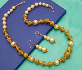 Grab This Pretty Simple And Elegant Looking Necklace Set In Golden Color Beautified With Moti Work. This Necklace Can be Paired With Any Colored Ethnic Attire, It Is Light Weight And Easy To Carry All Day Long.