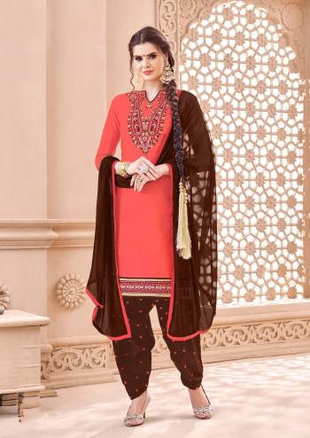 Add This Lovely Suit To Your Wardrobe In Dark Peach Color Paired With Contrasting Brown Colored Bottom And Dupatta. Its Top And Bottom Are Fabricated On Cotton Paired With Chiffon Dupatta. Get This Dress Material Stitched As Per Your Desired Fit And Comfort. 