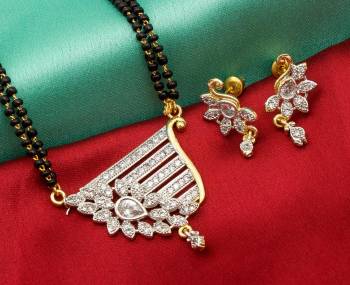 Grab This Designer Heavy Mangalsutra In Golden Color Beautified With Diamonds All Over. This Mangalsutra Comes With A Set Of Matching Earrings. It Is Light In Weight And Easy To Carry Throughout The Gala.  Buy Now.