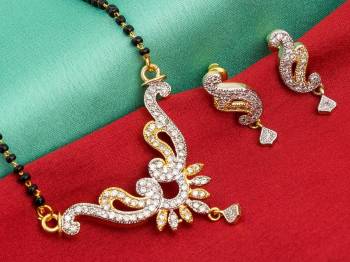 Grab This Designer Heavy Mangalsutra In Golden Color Beautified With Diamonds All Over. This Mangalsutra Comes With A Set Of Matching Earrings. It Is Light In Weight And Easy To Carry Throughout The Gala.  Buy Now.