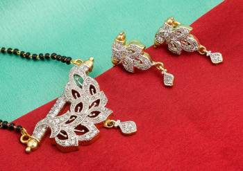 Grab This Designer Heavy Mangalsutra In Golden Color Beautified With Diamonds All Over. This Mangalsutra Comes With A Set Of Matching Earrings. It Is Light In Weight And Easy To Carry Throughout The Gala.  Buy Now.