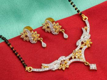 Grab This Designer Heavy Mangalsutra In Golden Color Beautified With Diamonds All Over. This Mangalsutra Comes With A Set Of Matching Earrings. It Is Light In Weight And Easy To Carry Throughout The Gala.  Buy Now.