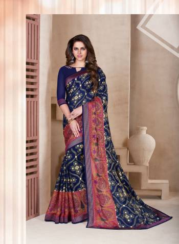 Enhance Your Personality Wearing This Saree In Navy Blue Color Paired With Navy Blue Colored Blouse. This Saree Is Fabricated On Chiffon Brasso Paired With Art Silk Fabricated Blouse. It Has Prints All Over The Saree.