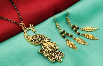 Here Is An Attractive Traditonal Patterned Mangalsutra Set In Golden Color. This Mangalsutra Comes With A Pair Of Earrings Beautified With Moti Work. This Unique Patterned Mangalsutra Will Earn You Lots Of Compliments From Onlookers. Buy Now.