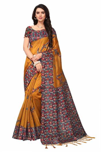 Celebrate This Festive Season With Beauty And Comfort Wearing This Saree In Musturd Yellow Color Paired With Contrasting Navy Blue Colored Blouse. This Saree And Blouse Are Fabricated On Kashmiri Art Silk Beautified With Floral Prints Over The Border And Blouse.