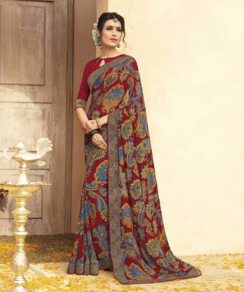 Grab This Beautiful Saree In Maroon Color Paired With Maroon Colored Blouse. This Saree And Blouse are Fabricated On Georgette Beautified With Bold Prints And Lace Border. Buy This Pretty Attractive Saree Now.