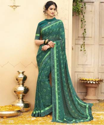 For Your Casual Or Semi-Casual Wear, Grab This Perrt Saree In Green Color Paired With Green Colored Blouse. This Saree And Blouse Are Fabricated On Georgette Beautified With Prints, Also It Is Light Weight And Easy To Carry All Day Long.