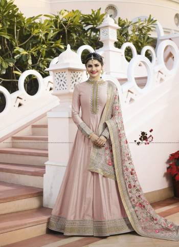 Flaunt Your Rich And Elegant Taste Wearing This Designer Floor Length Suit In Pastel Pink Colored Top Paired With Pastel Pink Colored Bottom And Grey Colored Dupatta. Its Top IS Fabricated On Art Paired With Santoon Bottom And Designer Net Fabricated Embroidered Dupatta. Buy Now