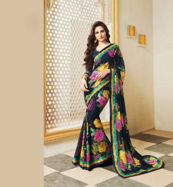 Enhance Your Personality Wearing This Saree In Navy Blue Color Paired With Navy Blue Colored Blouse, This Saree Is Fabricated On Silk Georgette Paired With Art Silk Fabricated Blouse. It Is Beautified With contrasting Bold Floral Print All Over. 