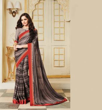 If Your Like Same Prints All Over The Saree Than Grab This Lovely Saree In Grey Color Paired With Grey Colored Blouse. This Saree Is Fabricated On Silk Georgette Paired With Art Silk Fabricated Blouse. Buy This Saree Now.