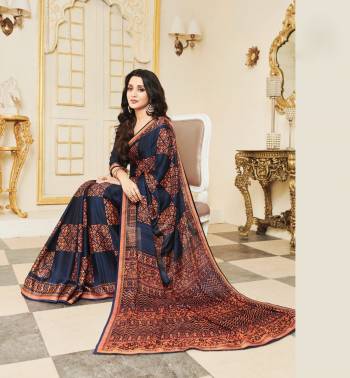 Enhance Your Personality Wearing This Saree In Navy Blue Color Paired With Navy Blue Colored Blouse, This Saree Is Fabricated On Silk Georgette Paired With Art Silk Fabricated Blouse. It Is Beautified With contrasting  Print All Over. 