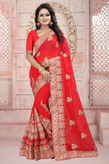 Adorn The Angelic Look Wearing This Saree In Red Color Paired With Red Colored Blouse. This Saree And Blouse Are Fabricated On Georgette Beautified With Heavy Embroidery. Buy This Attractive Looking Saree Now.