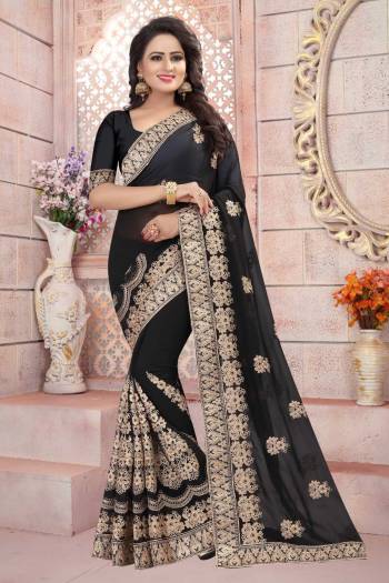 For A Bold And Beautiful Look, Grab This Saree In Black Color Paired With Black Colored Blouse. This Saree And Blouse Are Fabricated On Georgette Beautified With Jari Embroidery. Buy Now.