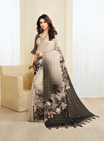 Flaunt Your Rich And Elegant Taste Wearing This Saree In Off-White And Brown Color Paired With Brown Colored Blouse. This Saree And Blouse Are Fabricated On Jute Silk Beautified With Checks And Floral Prints, Buttons And Tassels.