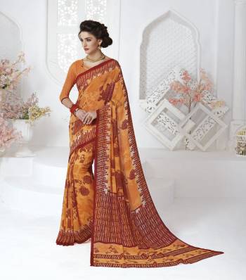 Orange Color Induces Perfect Summery Appeal To Any Outfit, So Grab This Simple Saree For Your Casual Wear In Orange Color paired With Orange Colored blouse. This Saree And Blouse Are Fabricated On Georgette Beautified With Contrasting Prints.