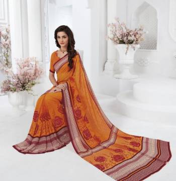 Orange Color Induces Perfect Summery Appeal To Any Outfit, So Grab This Simple Saree For Your Casual Wear In Orange Color paired With Orange Colored blouse. This Saree And Blouse Are Fabricated On Georgette Beautified With Contrasting Prints.