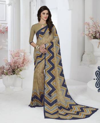 Simple And Elegant Looking Color Is Here With This This Saree In Beige Color Paired With Beige Colored Blouse. This Saree And Blouse Are Fabricated On Georgette Beautified With Prints. It Is Light Weight And Easy To Carry All Day Long.