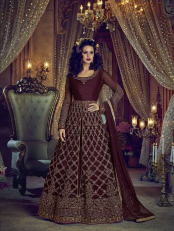 You Will Definitely Earn Lots of Compliments With This Royal Looking Designer Floor Length Suit In Maroon Colored Top Paired With Maroon Colored Pants, Lehenga And Dupatta. Its Top IS Fabricated On Net Paired With Art Silk Fabricated Lehenga And Pants And Net Fabricated Dupatta. This Heavy And Rich Looking Suit Is Beautified With Heavy Embroidery .