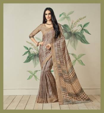 Simple Adnd Elegant Looking Saree Is Here In Beige Color Paired With Beige Colored Blouse. This Saree Is Fabricated On Jute Art Silk Paired With Art Silk Fabricated Blouse. It Has Pretty Sinple Prints All Over It. 