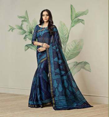 Enhance Your Personality Wearing This Printed Saree In Navy Blue Color Paired With Navy Blue Colored Blouse. This Saree Is Fabricated On Jute Art Silk Paired With Art Silk Fabricated Blouse. It Has contrasting Prints All Over The Saree.