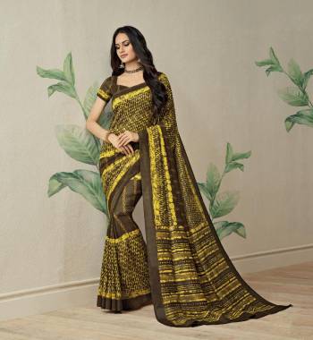 Lovely Color Pallete Has Been Used For This Saree, Grab This Saree In Brown And Yellow Color Paired With Brown Colored Blouse. This Saree Is Fabricated On Jute Art Silk paired With art Silk Fabricated Blouse. 