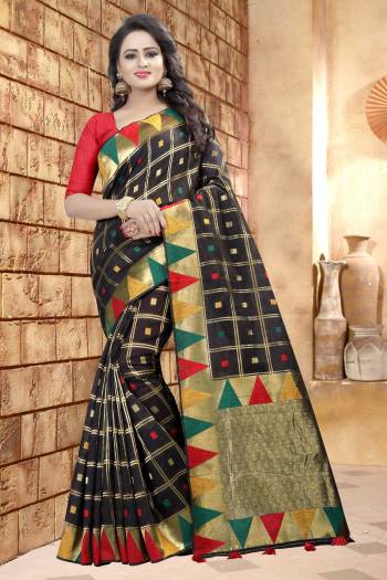 Add This Lovely Saree To Your Wardrobe In Black Color Paired With Red Colored Blouse. This Saree And Blouse Are Fabricated On Linen Beautified With Prints. It Is Light Weight And Easy To Carry All Day Long.