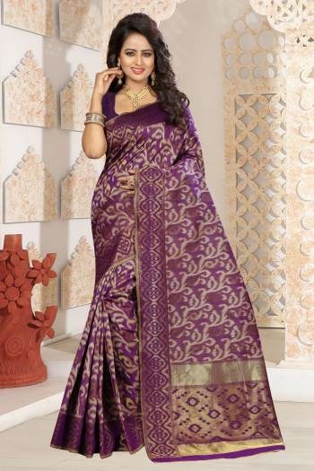 Add This Beautiful Colored Silk Saree To Your Wardrobe In Wine Color Paired With Wine Colored Blouse. This Saree And Blouse Are Fabricated On Kanjivaram Art Silk Beautified With Weave All Over. Buy This Saree Now.