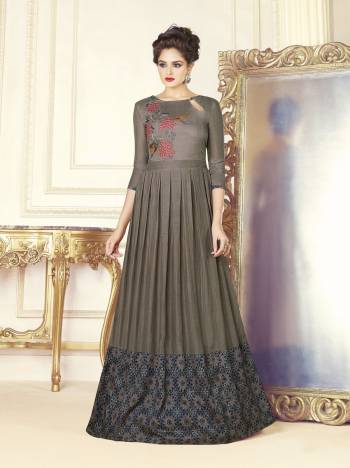 Elegant Looking Designer Floor Length Gown Is Here In Grey Color Fabricated On Soft Silk. This Pretty Readymade Gown Is Beautified With Prints And Thread Work. It Is Light In Weight And Easy To Carry All Day Long. Buy Now.