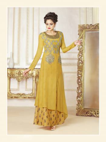 Celebrate This Festive Season Wearing This Designer Readymade Gown In Yellow Color Fabricated On Cotton Blend. This Pretty Gown Is Beautified With Prints And Embroidery. Buy This Lovely Gown Now.