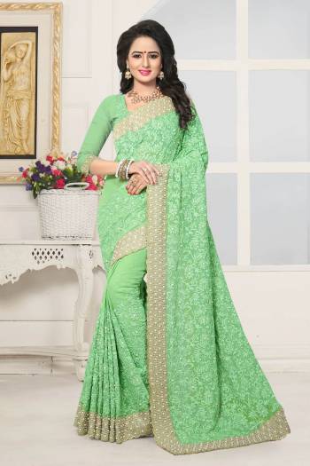 Grab This Pretty Shade In Green With This Heavy Designer Saree In Light Green Color Paired With Light Green Colored Blouse. This Saree And Blouse Are Fabricated On Georgette Beautified With Heavy Embroidery All Over It. It Has Lovely Pearl And Stone Work Making The Saree More Attractive.