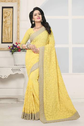 Celebrate This Festive Season Wearing This Heavy Designer Saree In Yellow Color Paired With Yellow Colored Blouse. This Saree And Blouse Are Fabricated On Georgette Beautified With Heavy Embroidery All Over It.