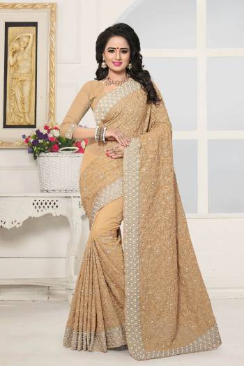 Simple And Elegant Looking Designer Saree Is Here In Beige Color Paired With Beige Colored Blouse. This Saree And Blouse Are Fabricated On Georgette Beautified With Heavy Embroidery. This Heavy Embroidered Saree Will Definitely Earn You Lots Of Compliments From Onlookers.