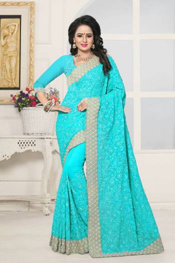 Very Pretty Shade In Blue Is Here With This Heavy Designer Saree In Turquoise Blue Color Paired With Turquoise Blue Colored Blouse. This Saree And Blouse Are Fabricated On Georgette Beautified With Heavy Embroidery. Buy This Designer Saree Now.