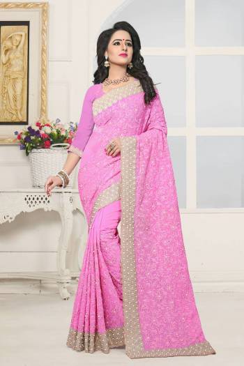 New Shade In Pink Is Here With This Heavy Designer Saree In Powder Pink Color Paired With Powder Pink Colored Blouse. This Saree And Blouse Are Fabricated On Georgette Beautified With Heavy Work Which Will earn You Lots Of Compliments From Onlookers.