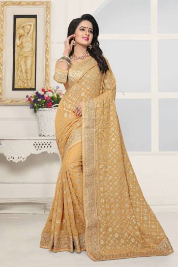 Simple And Elegant Looking Designer Saree Is Here In Beige Color Paired With Beige Colored Blouse. This Saree And Blouse Are Fabricated On Georgette Beautified With Heavy Embroidery. This Heavy Embroidered Saree Will Definitely Earn You Lots Of Compliments From Onlookers.