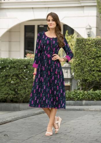 Enhance Your Personality Wearing This Designer Readymade Kurti In Navy Blue Color Fabricated On Cotton Satin Beautified With Contrasting Colored Prints All Over It. It Is Light In Weight And Ensures Superb Comfort All Day Long.