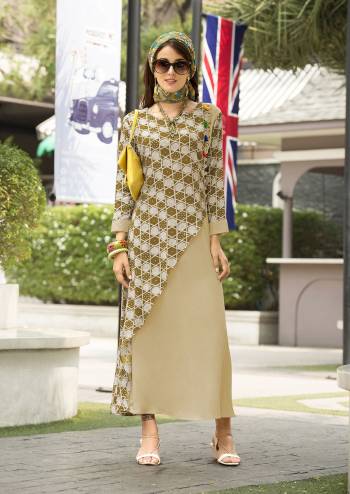 Simple And Elegant Looking Designer Readymade Kurti Is Here In Beige And Olive Green Color Fabricated On Cotton Satin. It Is Beautified With Prints And Pom-Poms Making The Kurti Attractive. Buy Now.