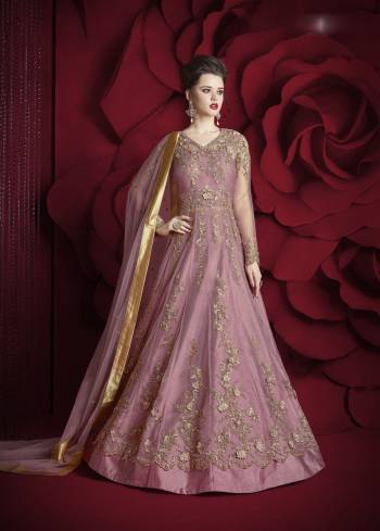 Look The Most Beautiful Of All Wearing Ths Designer Floor Length Suit In Pink Colored Top Paired With Pink Colored Bottom And Dupatta. Its Top Is Fabricated On Net Paired with Silk Fabricated Bottom And Net Dupatta. It Is Beautified With Jari And Thread Embroidery With Stone Work. Buy This Semi-Stitched Suit Now.