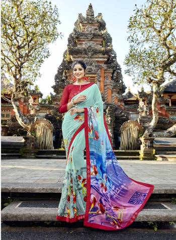 Quite Pretty Shade Is Here In Aqua Blue Colored Saree Paired With Contrasting Red Colored Blouse. This Saree Is Fabrocated On Georgette Paired With Art Silk Fabricated Blouse. This Saree Is Light Weight And easy To Carry All Day Long.