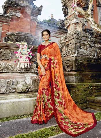 Orange & Red Color Induces Perfect Summery Appeal To Any Outfit, So Grab This Pretty Saree In Orange Color Paired With Contrasting Red Colored Blouse. This Saree Is Fabricated On Georgette Paired With Art Silk fabricated Blouse. Buy This Saree Now.