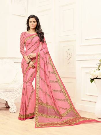 Look Pretty wearing This Printed Saree In Pink Color Paired With Pink Colored Blouse. This Saree And Blouse are Fabricated On Georgette Beautified With Prints All Over It.