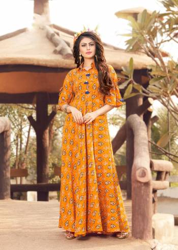 Bright And Visually Appealing Color Is Here With This Designer Readymade Long Kurti In Musturd Yellow Color Fabricated On Rayon Cotton. This Pretty Attractive Kurti Is Beautified With Simple Prints All Over It. It Is Light Weight And Easy To Carry All Day Long.