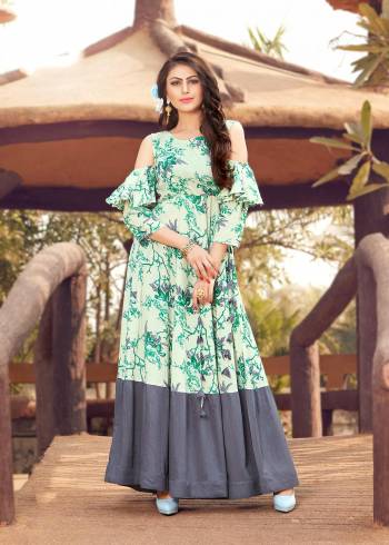 Very Pretty Cold Shoulder Patterned Designer Readymade Kurti Is Here In Off-White And Grey Color Fabricated On Rayon Cotton Beautified With Prints All Over. 