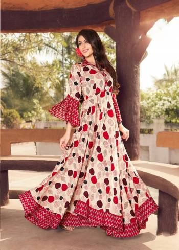 You Will Definitely Earn Lots Of Compliments Wearing This Designer Readymade Kurti In Beige And Red Color Fabricated On Rayon Cotton Beautified With Prints all Over. It Has Pretty Bell Sleeve Pattern Which Give A Very Pretty Look.