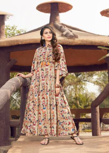 Here Is A Beautiful Designer Readymade Kurti In Beige And Multi Color. This Pretty Kurti Is Fabricated On Rayon Cotton Beautified With Prints All Over It. Its Pattern And Color Will Give A Pretty Look Like Never Before. 