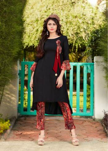 Enhance Your Beauty Wearing This Designer Readymade Kurti In Black Color Paired With Red Colored Bottom. This Kurti And Pant Are Fabricated On Rayon Beautified With Prints. Buy It Soon Before The Stock Ends.