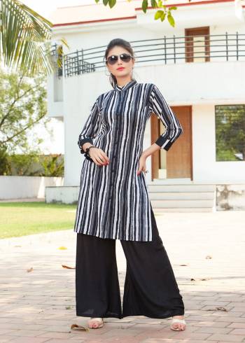 Add This Elegant Looking Readymade Kurti And Plazzo Set To Your Wardrbe Which IS Suitable Everywhere, Be It Your College, Office, Home Or For An Outing. Its Kurti Is In Black And White Color Paired With Black Colored plazzo. Both Are Fabricated On Rayon. Its Fabric Ensures Superb Comfort all Day Long. Buy Now.